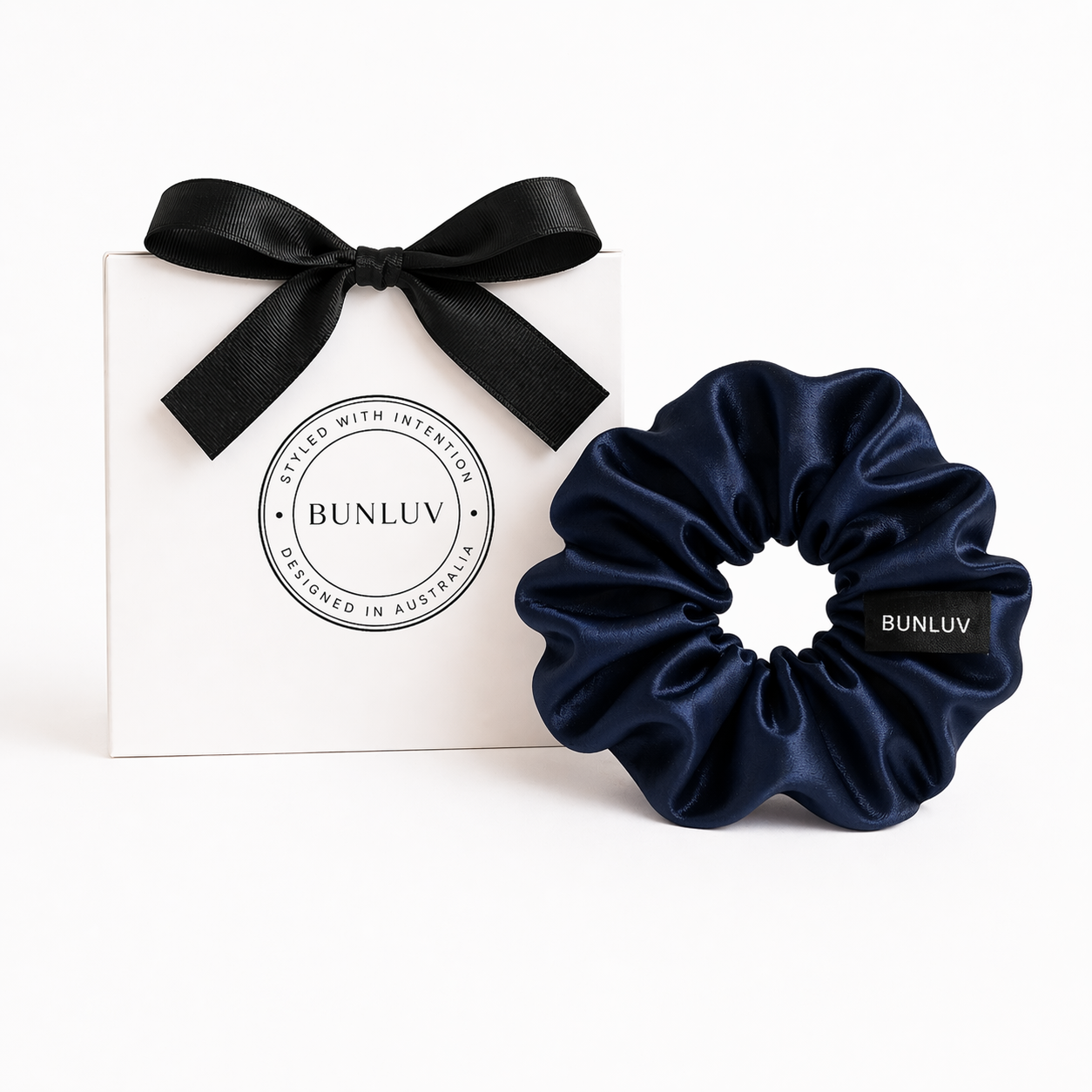 Navy satin scrunchie by BUNLUV, shown with gift box