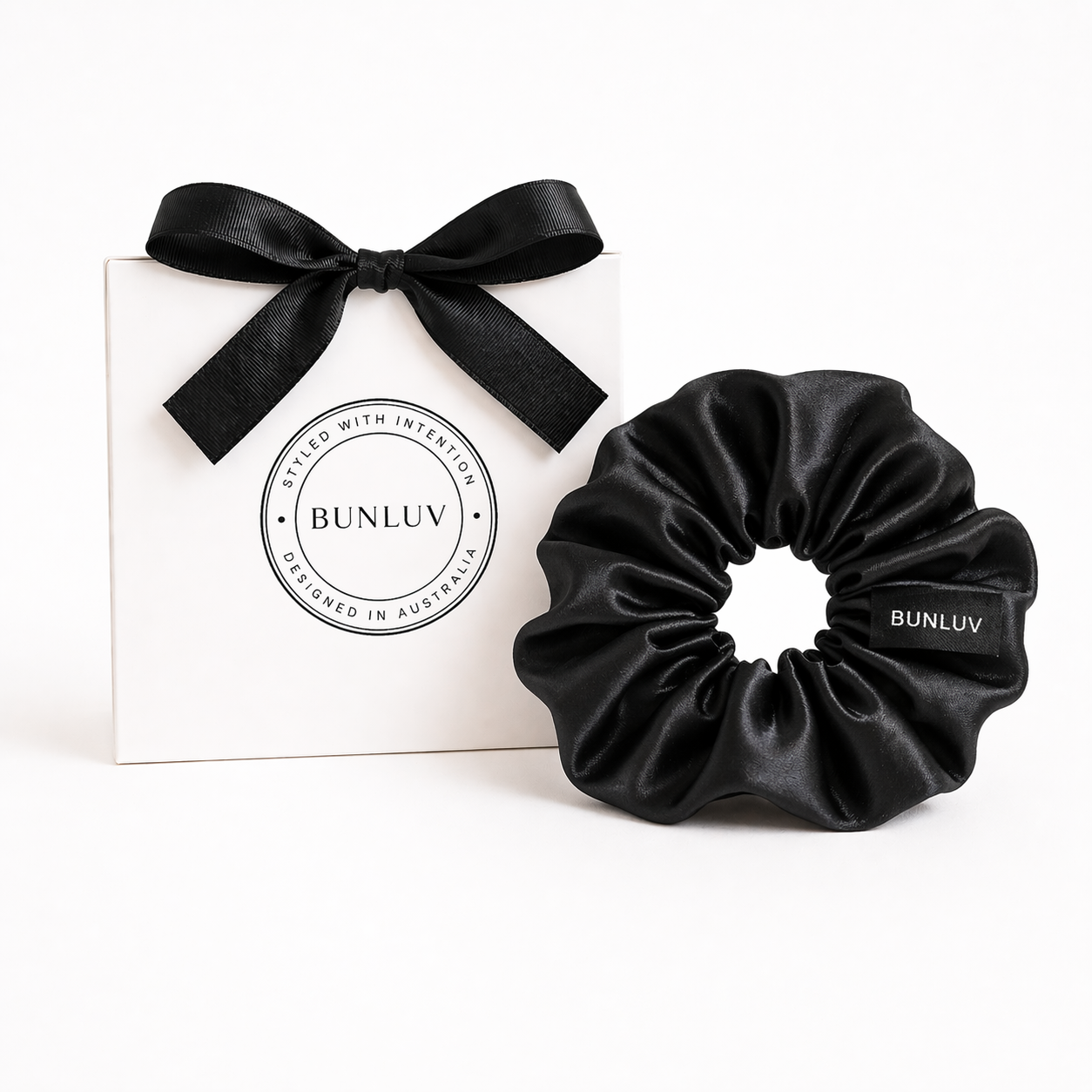 Black satin scrunchie by BUNLUV, shown with gift box