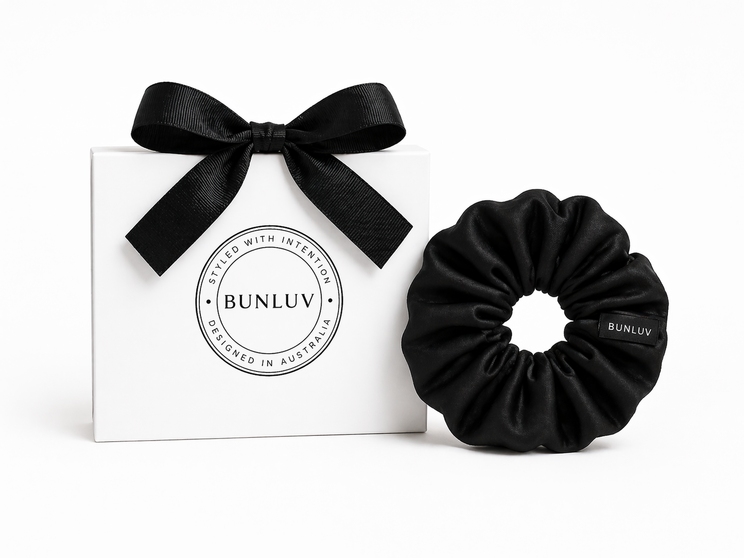 Black mulberry silk scrunchie by BUNLUV close-up on white background