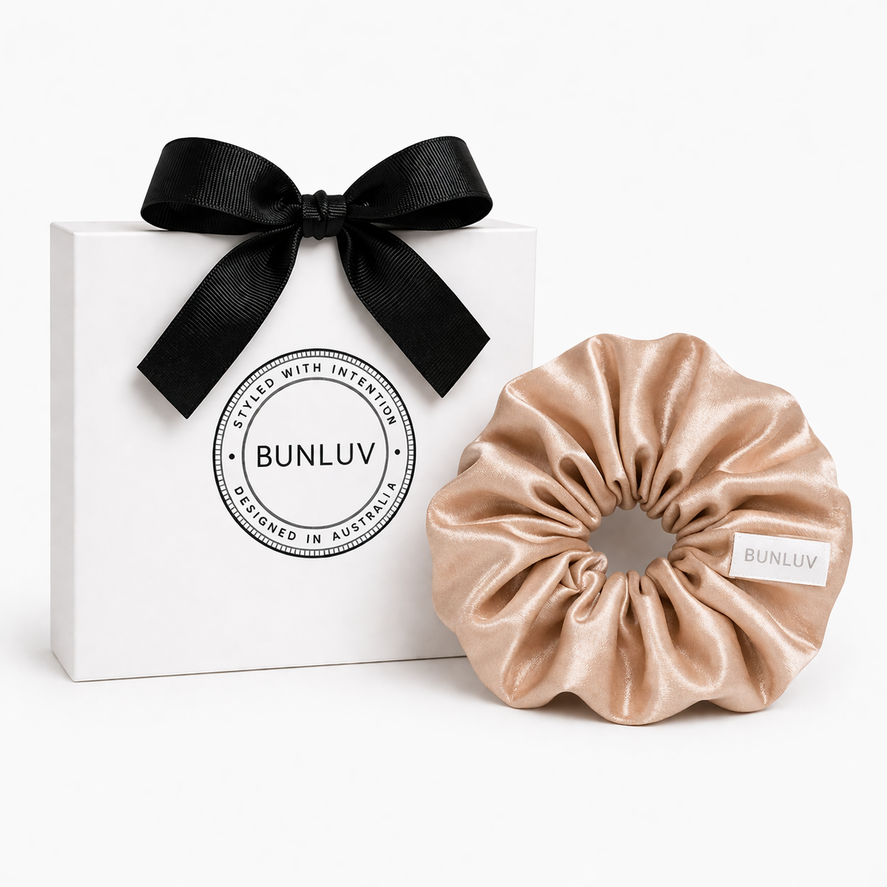 Beige scrunchie with black ribbon and white box on a white background, featuring the BUNLUV brand.